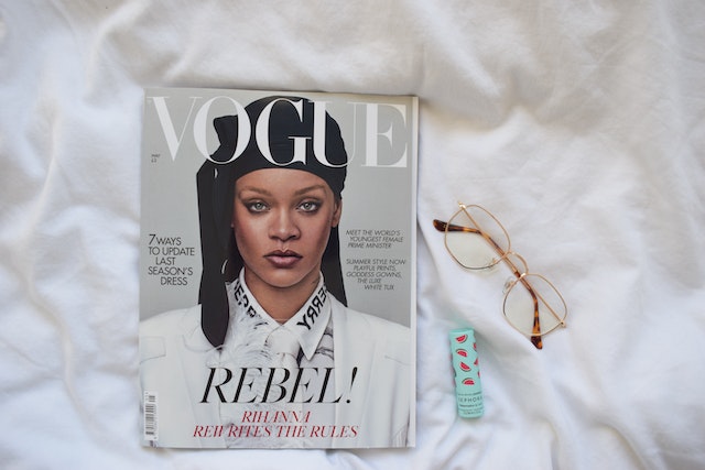 A copy of a Vogue magazine with the popstar Rihanna on the cover.