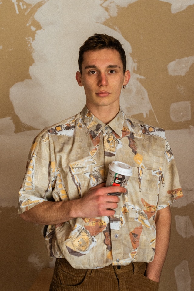 A young man wearing a vintage-inspired shirt.