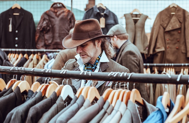A man shopping for vintage pieces at a  flea market