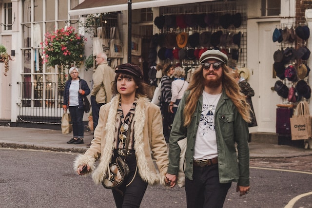 A couple in vintage wear walking the streets