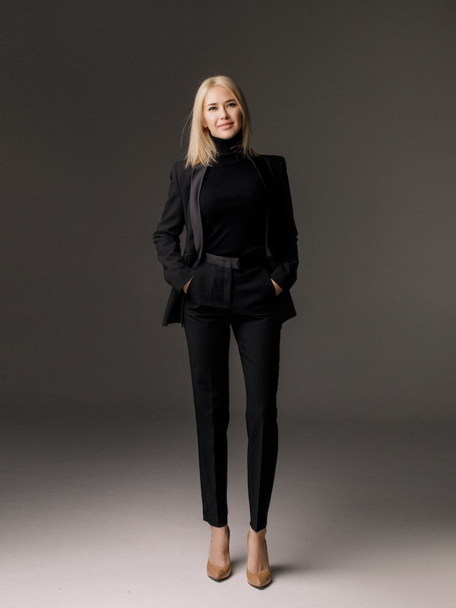Woman wearing an all-black suit ensemble